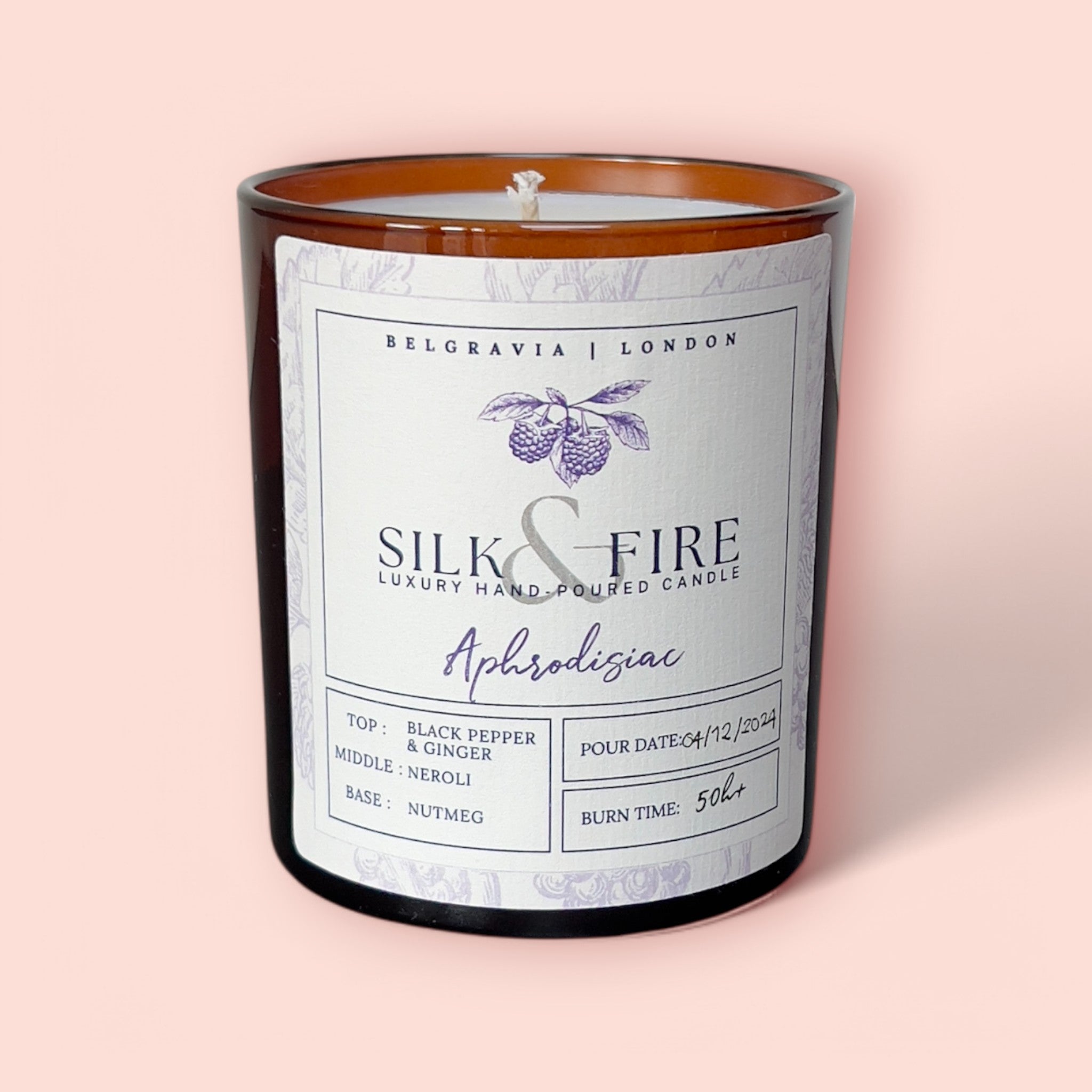 Silk & Fire Aphrodisiac Aromatherapy Candle in an amber jar, infused with sensual essential oils to enhance relaxation and mood. Handcrafted in London with natural coconut & rapeseed wax for a clean, toxin-free burn.